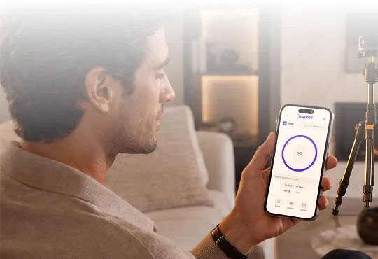 The Connect app open on a phone on site, with the iMapper on its tripod behind it